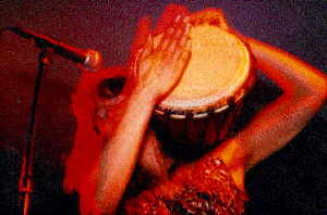 Anja playing djembe during the intro section of <i>The Higland Song</i>